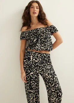 Outlet Cotton Club Off-shoulder top met tweekleurige print zwart